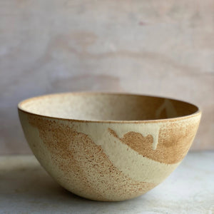 Julie Damhus Oda salad Bowl with a unique multi tonal caramel brown glaze that creates a natural painterly abstract pattern.