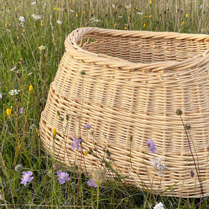 Catherine Beaumont's Contemporary Wash Basket is handwoven in stripped willow, with a traditional English tied base.