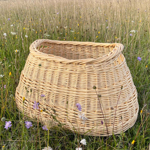 Catherine Beaumont's Contemporary Wash Basket is handwoven in stripped willow, with a traditional English tied base.