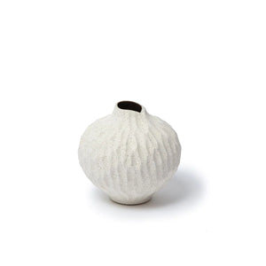Lindform’s Line sand cut vase has a natural colour and a sculpted surface pattern.