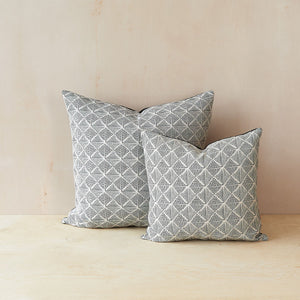 Large and small Beatrice Larkin Box Light merino wool cushions featuring a gentle monochrome geometric pattern