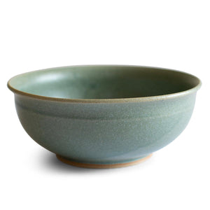 Deep ramen bowl with a softly curved rim. Hand-thrown artisan ceramic tableware handmade by Carla Murdoch in the UK. The bowl has an earthy green lichen colour glaze.