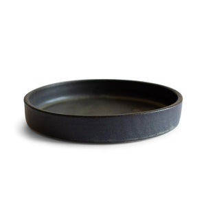 Hand-thrown artisan tapas dish. Ceramic tableware handmade by Carla Murdoch in the UK. The tapas dish has a dramatic black glaze with golden and khaki tones.