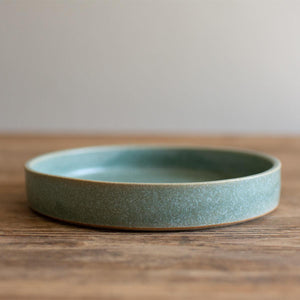 Hand-thrown artisan tapas dish. Ceramic tableware handmade by Carla Murdoch in the UK. The tapas dish has an earthy green lichen colour glaze.