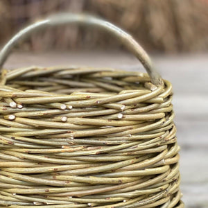 The Mini Forager basket, handwoven in willow by Rachel Bower, has a herringbone weave pattern known as chain wale. 