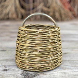 The Mini Forager basket, handwoven in willow by Rachel Bower, has a herringbone weave pattern known as chain wale. 