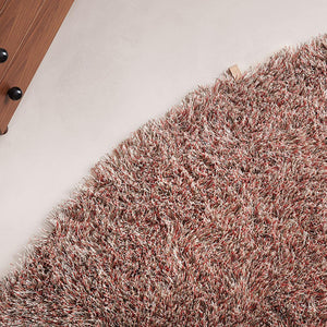 Kasthall’s Almond Blush Fogg rug is designed by Gunilla Lagerhem Ullberg.  The long pile round Fogg rug has a variety of shades of blush pink creating a shimmering colour effect, full of lustre. The rug is on a pale pink floor, next to wooden furniture.