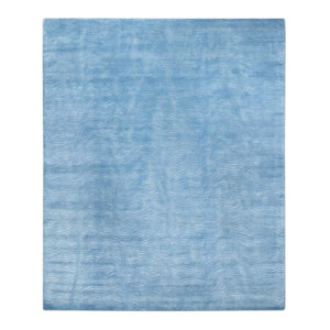 Knots Rugs' Blue Waves Rug features a simple undulating wave pattern that ripples through the silk pile. With the waves woven in wool on a background of silk this rug is full of textural character.