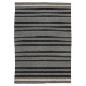 The Fabula Living Fleur Rug features stripes-within-stripes. The well-balanced pattern is woven in harmonious ash grey and black.