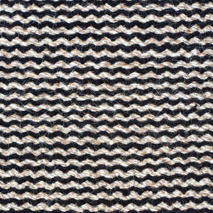 A close up image of the weave pattern of the Fabula Living’s Black/Natural Fenris Rug -designed by Jens Landberg Schrøder