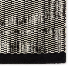 A close up look ate the pattern of the Fabula Living’s Black/Off White Gro Rug, The Gro Rug’s gentle graphic pattern contrasts natural colours with off white / beige - designed by Jens Landberg Schrøder.