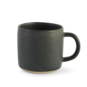 Blue Oda Mug by Julie Damhus Studio. The mug has a minimalist, rounded form and deep inky blue colour.