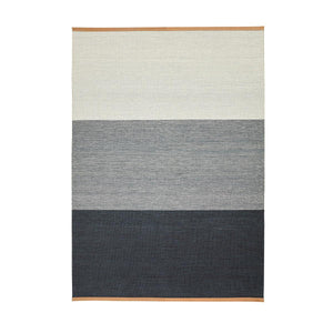 Design House Stockholm Blue/Grey Fields Rug, by Lena Bergström, had a block striped pattern with a light colour stripe one end, graduating to a dark blue grey stripe at the other end. The flatwoven wool rug has a flecked colour effect in the weave.