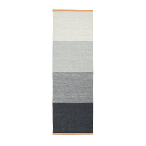 Design House Stockholm Blue/Grey Fields Rug, by Lena Bergström, had a block striped pattern with a light colour stripe one end, graduating to a dark blue grey stripe at the other end. The flatwoven wool rug has a flecked colour effect in the weave.