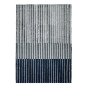 Tacto's Campos Blue Rug, This linear, textured and tonal striped rug is handwoven with an 8 mm wool pile. Colours graduate from navy to sky blues - designed by Aranda Aloy Enblanc.
