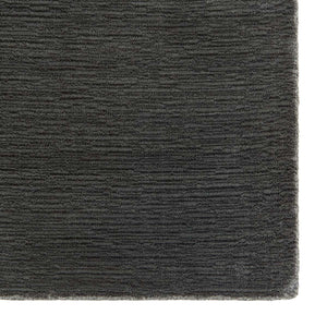 A close up images of Fabula Living’s Nanna Rug which has a lovely charcoal colour and textured wool pile  -designed by Jens Landberg Schrøder