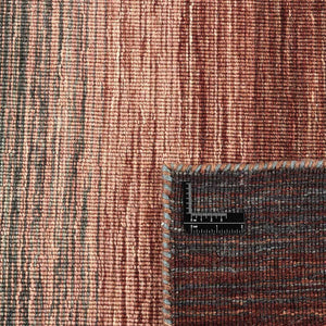 A close look at the texture of the Rezas' Brown Panorama Kelim Rug with its handwoven autumnal colour pallet.