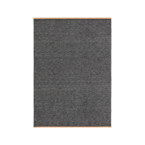 Design House Stockholm Dark Grey Björk Rug, designed by Lena Bergström. Flatweave wool rug with a speckled colour effect in the weave and leather edges.