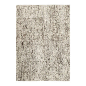 Dove Rainbow Rug is handwoven in felted wool and cotton, creating a unique chunky weave with flecks of darker brown that create a speckled pattern across the beige-grey rug - by Rezas