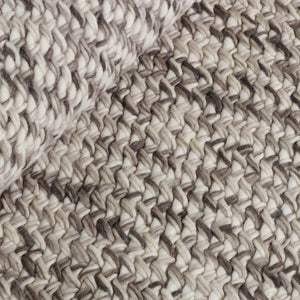 A close up look at Dove Rainbow Rug with handwoven felted wool and cotton, creating a unique chunky weave with flecks of darker brown that create a speckled pattern across the beige-grey rug - by Rezas