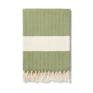 moss green herringbone pattern blanket with contrasting cream band finished with a cream knotted fringe at each end. Ferah organic cotton blanket by Lüks. 