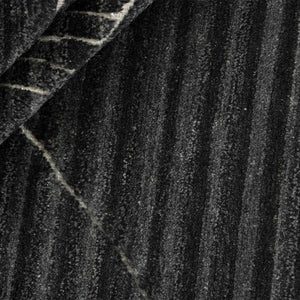 A closer look at Fields Charcoal Landscape Rug Hand knotted with its abstract pattern markings in light grey on rich dark charcoal - by Rezas