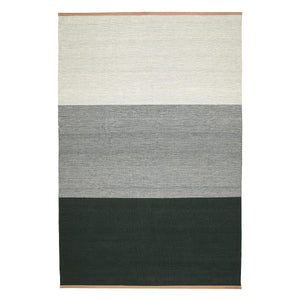Design House Stockholm Green/Grey Fields Rug, by Lena Bergström, displays block shades of greys and green, finished with a leather trim at either end.