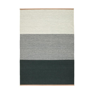 Design House Stockholm Green/Grey Fields Rug, by Lena Bergström, displays block shades of greys and green, finished with a leather trim at either end.