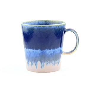 This vibrant blue mug features SGW Lab’s signature colour-contrast glaze. Every handmade mug is unique as the glaze will vary slightly from mug to mug.
