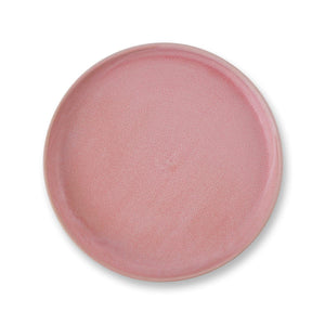 Julie Damhus’ Rose pink Toto Plate is minimalist in form and decorated with speckled colour glaze.