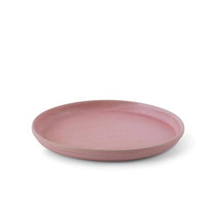 Julie Damhus’ Rose pink Toto Plate is minimalist in form and decorated with speckled colour glaze.