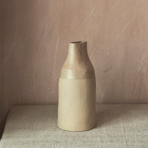 Be Still Two Tone Buff Pinched Bottle is beige in colour and has an organic form and rustic feel.